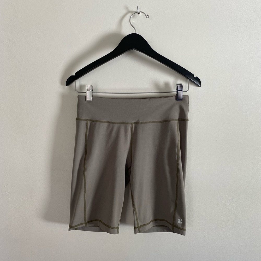 Green Sweaty Betty compression shorts
